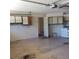 View of the garage with ample cabinets for storage and laundry area at 714 Fox Tail Ct, New Smyrna Beach, FL 32168