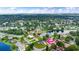 Aerial view showcasing the property in a serene, lakeside neighborhood, enhanced by lush greenery at 800 Black Duck Dr, Port Orange, FL 32127
