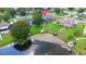 Aerial view of a home with a pool, lush backyard, dock and waterfront access at 800 Black Duck Dr, Port Orange, FL 32127