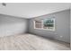 Bright bedroom has tile floors, light gray walls, and large window filling the space with light at 800 Black Duck Dr, Port Orange, FL 32127