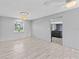 Cozy dining room with tile floors, neutral walls, ceiling fan, and natural light with kitchen view at 800 Black Duck Dr, Port Orange, FL 32127