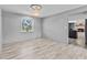 Inviting dining room with tile floors, modern lighting, and neutral walls. Kitchen access at 800 Black Duck Dr, Port Orange, FL 32127