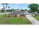 Charming brick home with well-manicured lawn and solar panels offers classic curb appeal at 800 Black Duck Dr, Port Orange, FL 32127