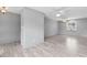 Spacious living area features tile floors, neutral paint, ceiling fan, and bright natural light at 800 Black Duck Dr, Port Orange, FL 32127