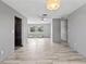Large living space features tile floors, neutral walls, bright window, and modern light fixtures at 800 Black Duck Dr, Port Orange, FL 32127