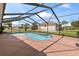 Backyard pool featuring a full screen enclosure, beautiful backyard, and patio area at 800 Black Duck Dr, Port Orange, FL 32127