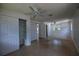 Large bedroom featuring tile flooring, ceiling fan, and multiple closet doors at 805 E 18Th Ave, New Smyrna Beach, FL 32169