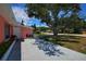 Manicured landscaping and mature trees complement this home's exterior, creating a welcoming and serene atmosphere at 805 E 18Th Ave, New Smyrna Beach, FL 32169