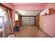 Spacious garage featuring an American flag and ample storage space, ready for your projects or parking needs at 805 E 18Th Ave, New Smyrna Beach, FL 32169