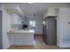 Well-lit kitchen with white cabinets, stainless steel appliances, and a tiled floor at 805 E 18Th Ave, New Smyrna Beach, FL 32169