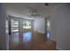 Inviting living room features terrazzo floors, natural light, and a ceiling fan at 805 E 18Th Ave, New Smyrna Beach, FL 32169