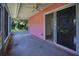 Covered and screened in porch with views of fenced yard at 805 E 18Th Ave, New Smyrna Beach, FL 32169