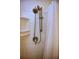 Shower featuring white tile and bronze shower head with sprayer at 805 E 18Th Ave, New Smyrna Beach, FL 32169