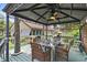 Charming outdoor gazebo with ample seating and mature landscaping at 807 Craig St, New Smyrna Beach, FL 32168