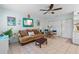 Cozy living room features tile floors, storage, comfortable furniture, and charming decor at 807 Craig St, New Smyrna Beach, FL 32168