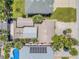 Aerial view of the home showcasing the layout with pool, firepit area and proximity to other houses at 821 Ocean Ave, New Smyrna Beach, FL 32169