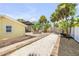 Spacious backyard with a charming firepit area, landscaping, and outdoor living space at 821 Ocean Ave, New Smyrna Beach, FL 32169