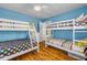 Bright bedroom with twin bunk beds, colorful polka dot and striped bedding at 821 Ocean Ave, New Smyrna Beach, FL 32169