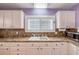 Bright kitchen with white cabinets, laminate countertop, and modern appliances at 821 Ocean Ave, New Smyrna Beach, FL 32169