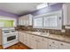 Bright kitchen with white cabinets, laminate countertop, and modern appliances at 821 Ocean Ave, New Smyrna Beach, FL 32169