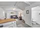 Living room with vaulted ceilings, ceiling fan, wet bar and door to bathroom at 821 Ocean Ave, New Smyrna Beach, FL 32169