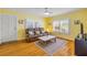 Bright living room with hardwood floors, a comfortable sofa, and charming decor at 821 Ocean Ave, New Smyrna Beach, FL 32169