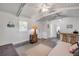 Spacious room offering vaulted ceilings, ceiling fan and adjacent wet bar at 821 Ocean Ave, New Smyrna Beach, FL 32169