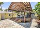 Cozy pergola and outdoor bar area, perfect for entertaining and enjoying the outdoors at 821 Ocean Ave, New Smyrna Beach, FL 32169