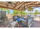 Outdoor living space with pergola providing shade and comfort for Gathering and friends at 821 Ocean Ave, New Smyrna Beach, FL 32169