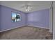 Comfortable carpeted bedroom with a window, offering a serene and inviting space at 837 Acorn Ln, Port Orange, FL 32127