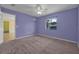 Cozy carpeted bedroom with a window and a neutral color palette, ready for personalization at 837 Acorn Ln, Port Orange, FL 32127