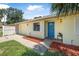 Charming single-story home with a bright blue front door and well-maintained landscaping at 837 Acorn Ln, Port Orange, FL 32127