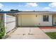 Attached garage with paved driveway, offering convenient parking at 837 Acorn Ln, Port Orange, FL 32127