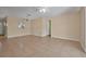 Bright living area with tiled floors and a view into the connected kitchen space at 837 Acorn Ln, Port Orange, FL 32127