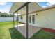 Covered patio with tile flooring, perfect for outdoor entertaining at 837 Acorn Ln, Port Orange, FL 32127