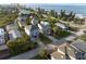 Aerial view of coastal home with tropical landscaping near the ocean, offering scenic beachfront living at 895 Catfish Ave, New Smyrna Beach, FL 32169