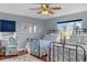Comfortable bedroom featuring two beds, wooden floors, and a coastal-themed decor at 895 Catfish Ave, New Smyrna Beach, FL 32169