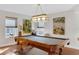 Traditional game room boasting a billiard table, vintage-style lighting, and three large framed wall paintings at 895 Catfish Ave, New Smyrna Beach, FL 32169