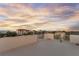 Scenic rooftop deck boasting expansive neighborhood views and gorgeous sky at dusk at 895 Catfish Ave, New Smyrna Beach, FL 32169