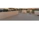 Expansive rooftop with a white railing, offering panoramic views of the surrounding neighborhood and distant ocean at 895 Catfish Ave, New Smyrna Beach, FL 32169