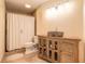 Charming bathroom with a stone sink, wooden vanity, and a tiled shower with a curtain at 904 Clubhouse Blvd, New Smyrna Beach, FL 32168