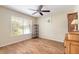 Bedroom featuring wood-look floors, natural light, and a ceiling fan at 904 Clubhouse Blvd, New Smyrna Beach, FL 32168