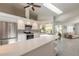 Bright kitchen with white cabinets, stainless steel appliances, and a modern backsplash design at 904 Clubhouse Blvd, New Smyrna Beach, FL 32168