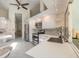 Bright kitchen featuring white cabinetry, stainless steel appliances, and an open layout design at 904 Clubhouse Blvd, New Smyrna Beach, FL 32168