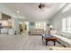 Spacious living room with open floor plan, light tile flooring, and access to the lanai at 904 Clubhouse Blvd, New Smyrna Beach, FL 32168