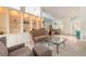 Open living room featuring display shelves and view into the dining area and front door at 904 Clubhouse Blvd, New Smyrna Beach, FL 32168