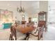 Bright living area features chandelier, tile floors and view to formal seating and built-in china cabinet at 904 Clubhouse Blvd, New Smyrna Beach, FL 32168