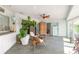 Bright sunroom with tiled floors, modern furniture, large windows, and natural light at 904 Clubhouse Blvd, New Smyrna Beach, FL 32168