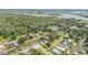 Overhead shot of homes along a canal, surrounded by mature trees and tranquil waterfront living at 154 Godfrey Rd, Edgewater, FL 32141