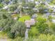 An aerial view of a home with lush green landscaping and waterfront access on a canal, providing serene outdoor living at 154 Godfrey Rd, Edgewater, FL 32141